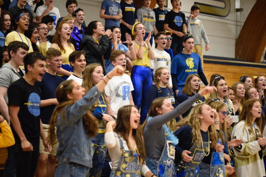 Seniors rise on their feet, in a show of Spartan Spirit.