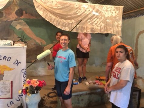 Lauren Osteraas painting churches as missionary work.