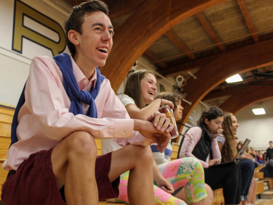 Senior Sawyer Johnson smiles as he observes the homecoming dodgeball tournament. 