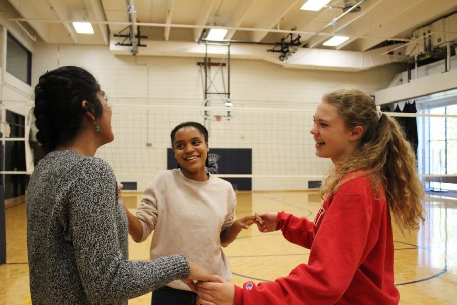 Seniors Mashal Naqvi, Rachael Johnson, and Izzy Dieperink enjoy tutorial at the Oct. 4 Latin Dance Party.