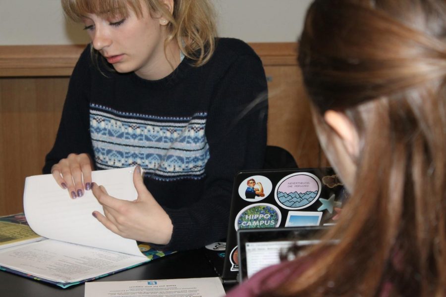 Senior Adelia Bergner leafs through flyers for an upcoming women in tech event that she will share with club attendees. She started the group along with Nitya Thakkar: We decided that we wanted to have a safe space in the club where people could come and talk about issues that they’re facing if they want to pursue something in STEM, but also to have an environment where we can promote inclusivity in the world of tech, Bergner said.