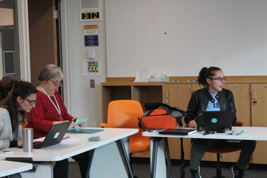 US Math Teacher Mary Lincoln, US English Teacher Kristen Collier, and Senior and President of People for Environmental Protection, Iris Shaker-Check, have a weekly meeting to catch up on their current projects. 