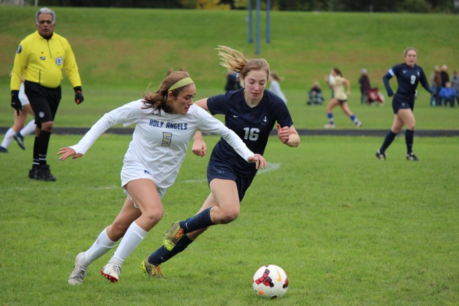 Sophomore Julia Scott chases the ball.