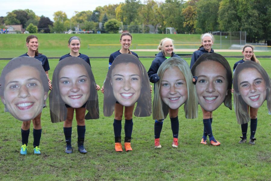 Seniors pose with their big heads.