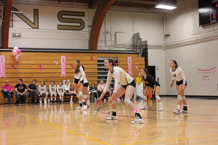 Junior Audrey Egly and seniors Blythe Rients, Mia Litman, and Mimi Geller wait for the other team to serve the ball.