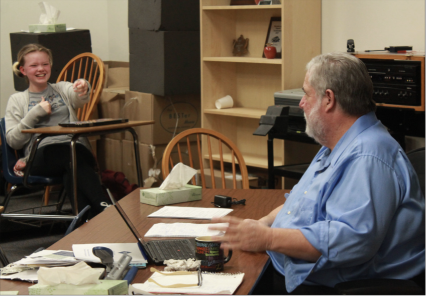 Tom Fones and 9th Grader Maura Hartfeldt share a joke during Beginning Debate class.