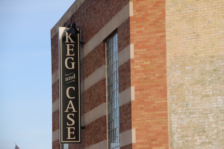 The Keg and Case market sign outside of the old Scjmidt Brewery's "keg house," 