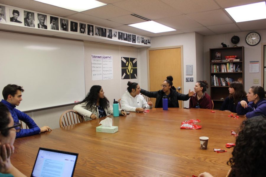 IC members share around a Harkness table. 