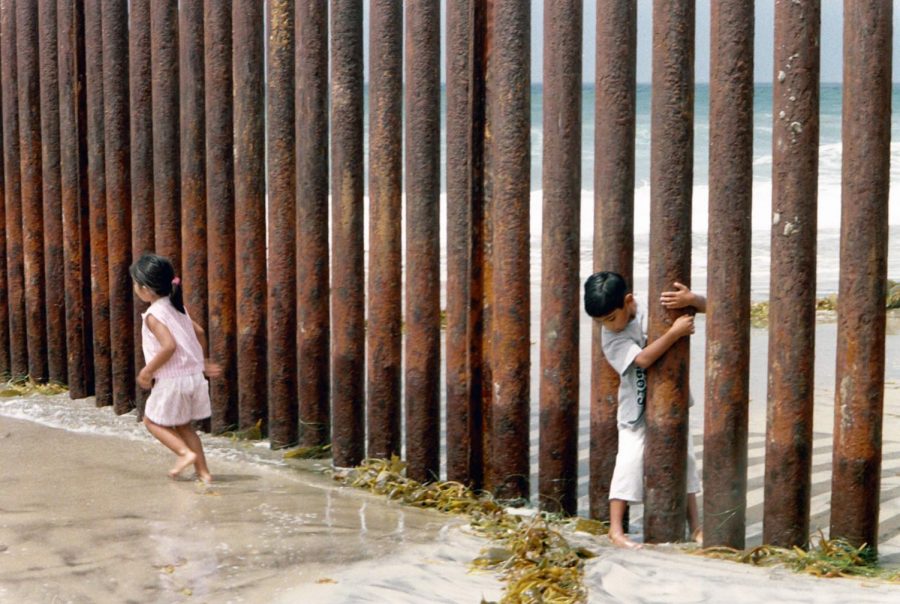 Children play on the border fence in Tijuana, Mexico. 