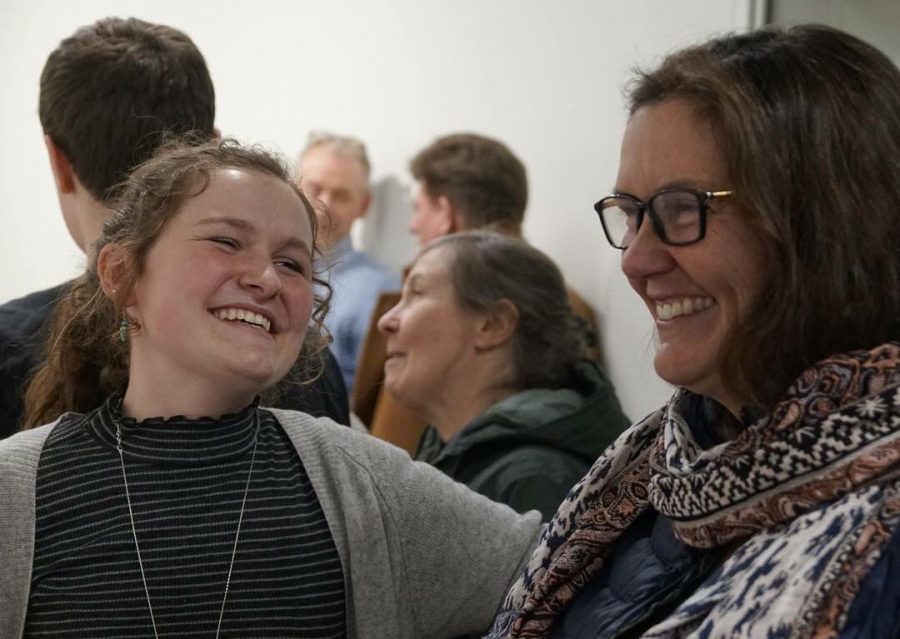 Senior Betsy Romans laughs with former ASR teacher Beth Siebel-Hunt. 