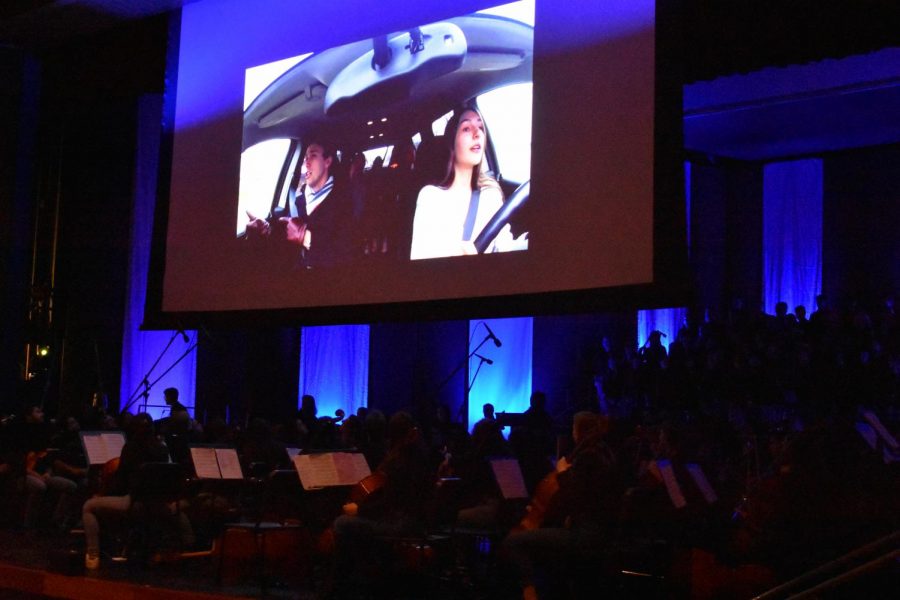 The smart board in action. Seniors Max Moen and Mimi Geller perform a Queen song as they drive through St. Paul. Many other students were featured in the Carpool Karaoke.