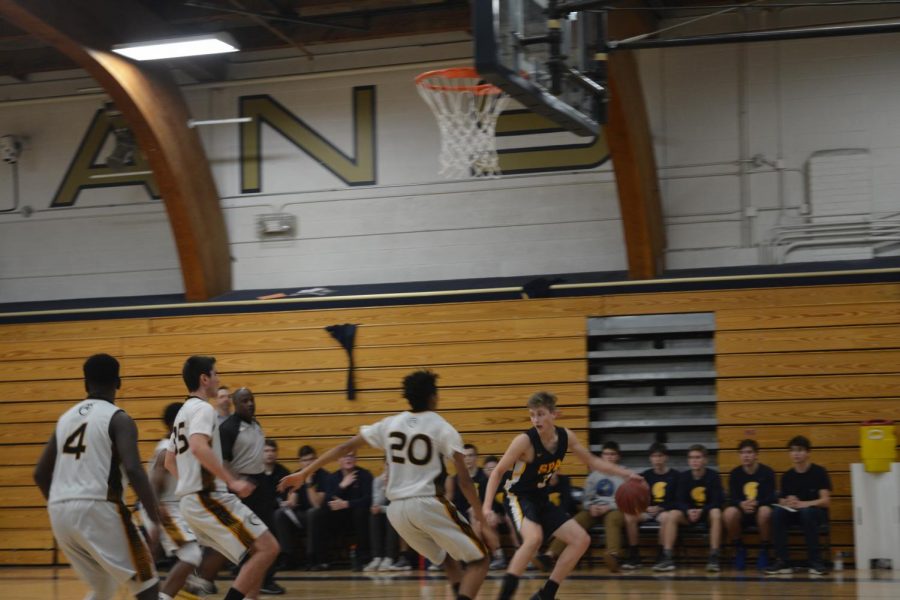 Sophomore Adam Holod secures his possession of the ball.