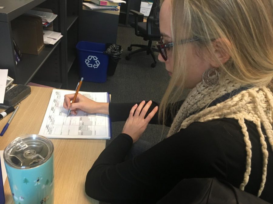 Ms. Armstrong using her SPA provided planner.
Photo Credits: Tana Ososki