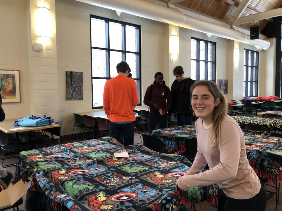 Senior Tessah green works on a tie-blanket for the My Very Own Bed organization. 