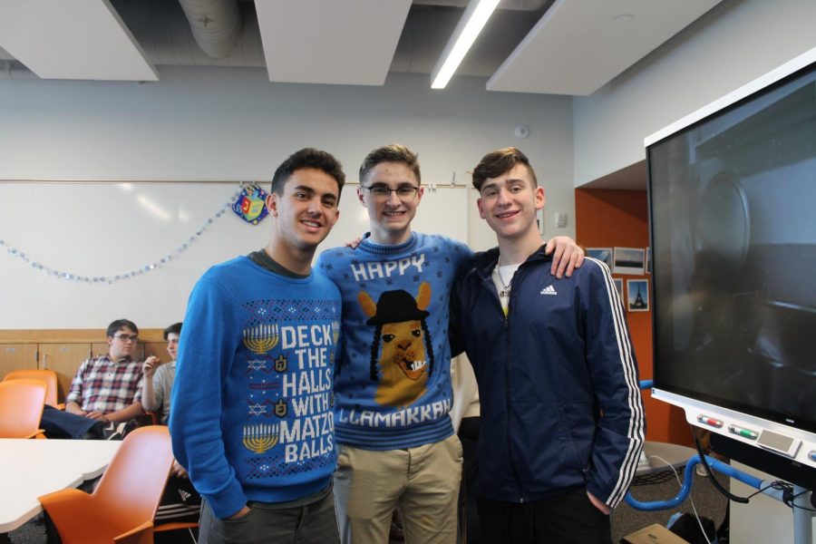 Seniors Ethan Less, Shane Litman and 
Reuben Vizelman wear Hanukkah-themes sweaters.