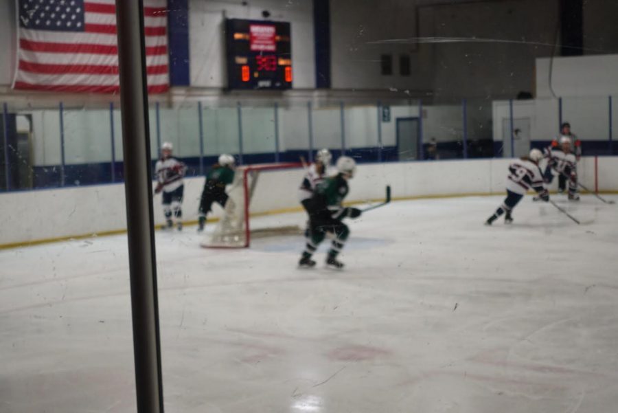 United playing defense with senior goalie Kenzie Giese in the net.