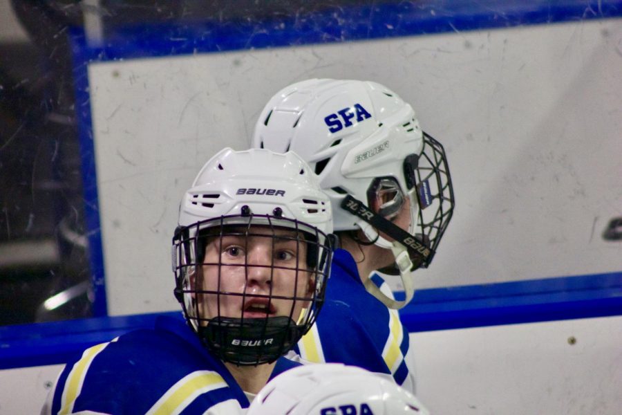 Junior Thomas Bagnoli talks with coach after playing against Minnehaha. 