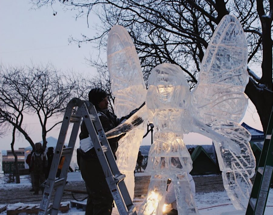 Ice sculptors work on their pieces during the carnival, allowing anyone to watch the progress of the sculpting.