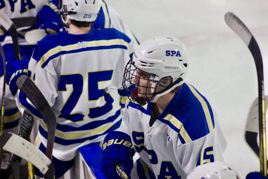 Sophomore Will Schavee talks to his coach after playing in the game. 