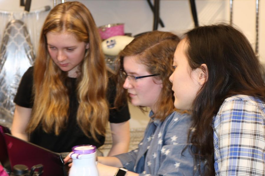 Seniors Lily Nestor and Gemma Yoo, and 9th grader Sophie Cullen discuss Science Olympiad plans.