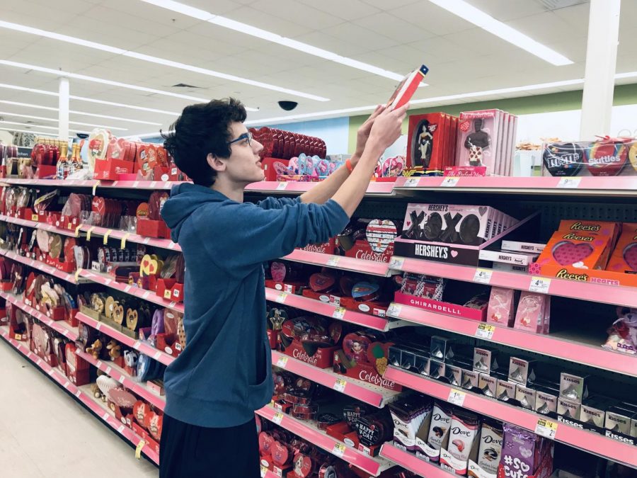 Junior Ryan Strobel examines Valentines Day products at Walgreens on Randolph Ave.