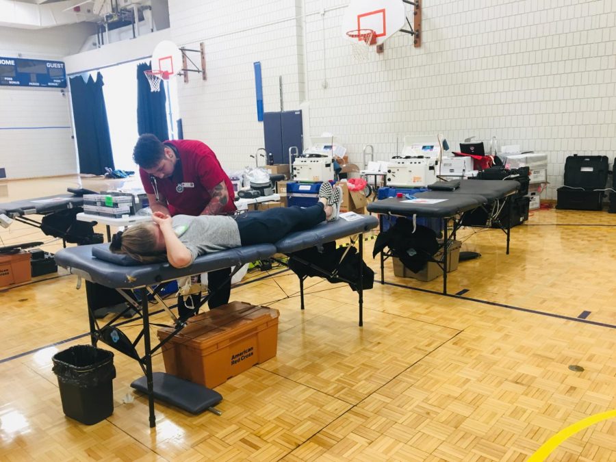 Students getting their blood drawn in the small gym