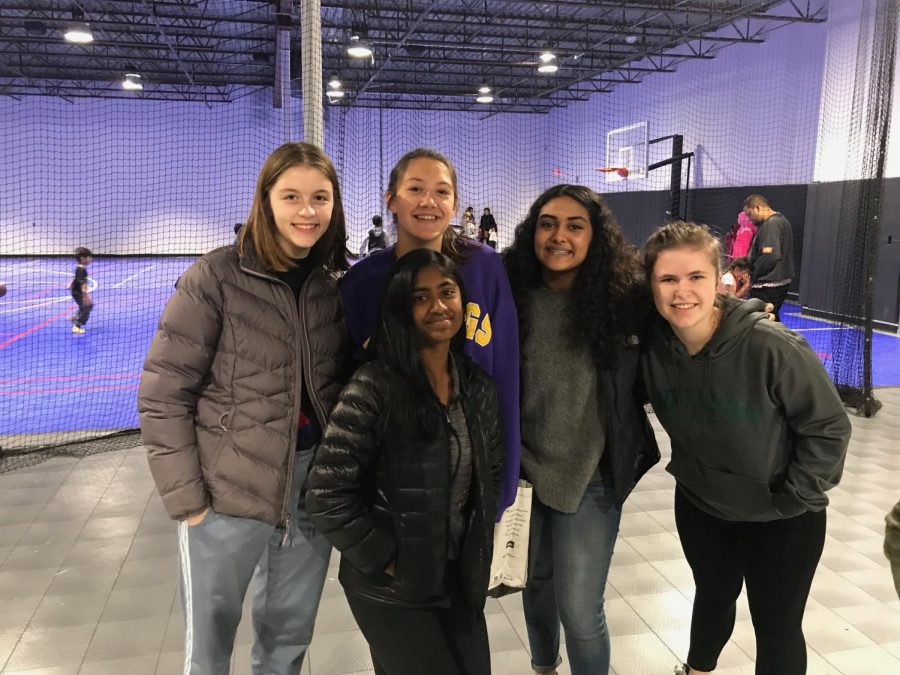 Sophomores Lynn Reynolds, Annika Rock, Rashmi Raveendran, Aman Rahman and Elaina Parsons pose for a picture while volunteering at the food shelf. 