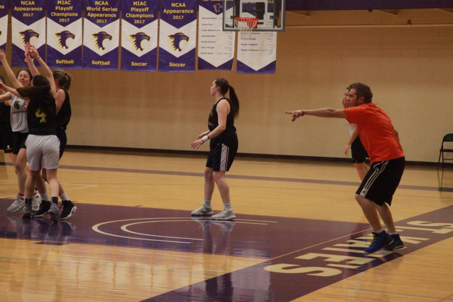 Head+girls+varsity+basketball+coach+Nick+Novak+instructs+players+through+a+drill