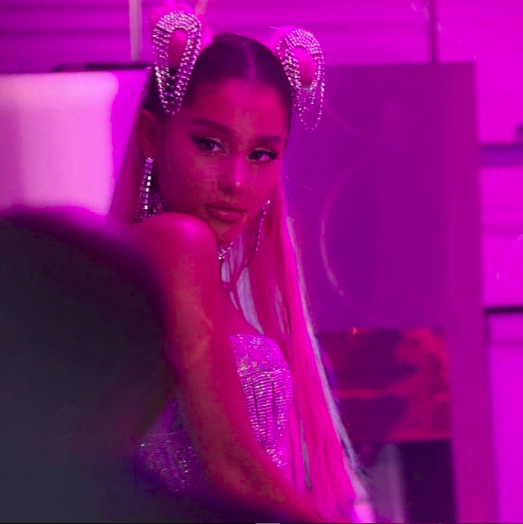 Ariana Grande poses for a photo while filming her controversial music video for her hit single "7 rings".