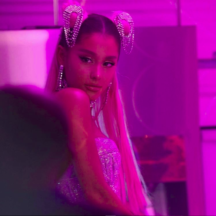 Ariana Grande poses for a photo while filming her controversial music video for her hit single 7 rings.