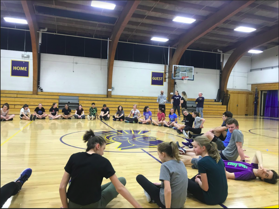 The track team practices inside the gym while they still aren't able to get outside.