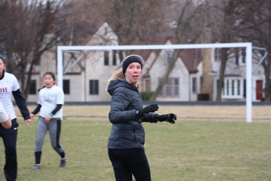 Junior Abby Hedberg cuts out into the field to run an offensive play against Cretin. 