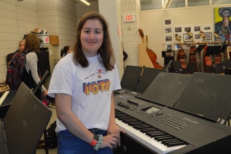 Isabelle Wolpert sitting the Orchestra room.