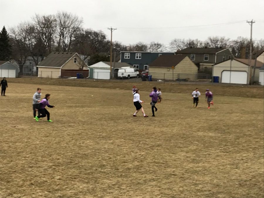 Senior Matt Pauley runs to catch a pass.