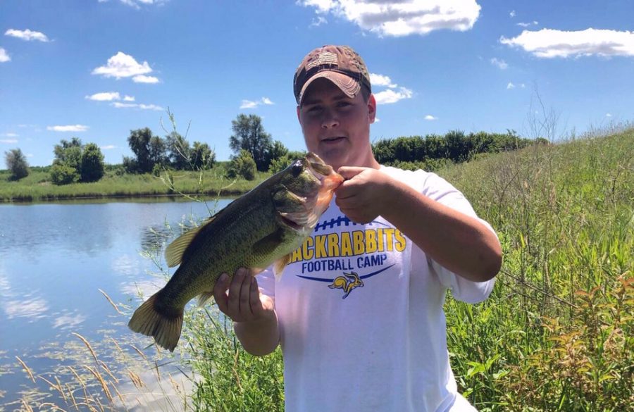 Senior+Riley+Tietel+holds+his++five+pound+largemouth+bass.