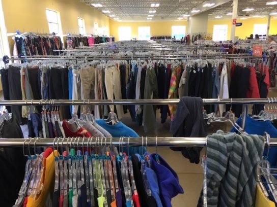 Goodwill, the original "thrift" store before it became a trend, features rows upon rows of sustainable clothing. 