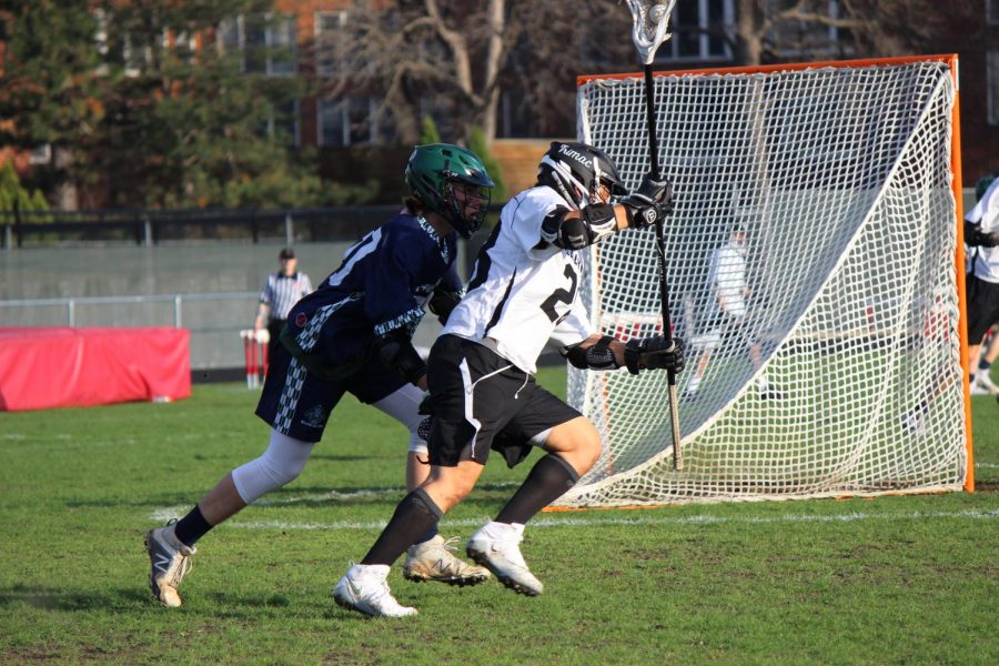 Two members of the opposing teams try to get the ball.