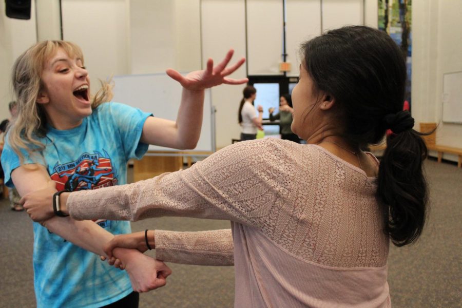 HerSpace co-presidents Adelia Bergner and Nitya Thakkar practice the front cat move. 