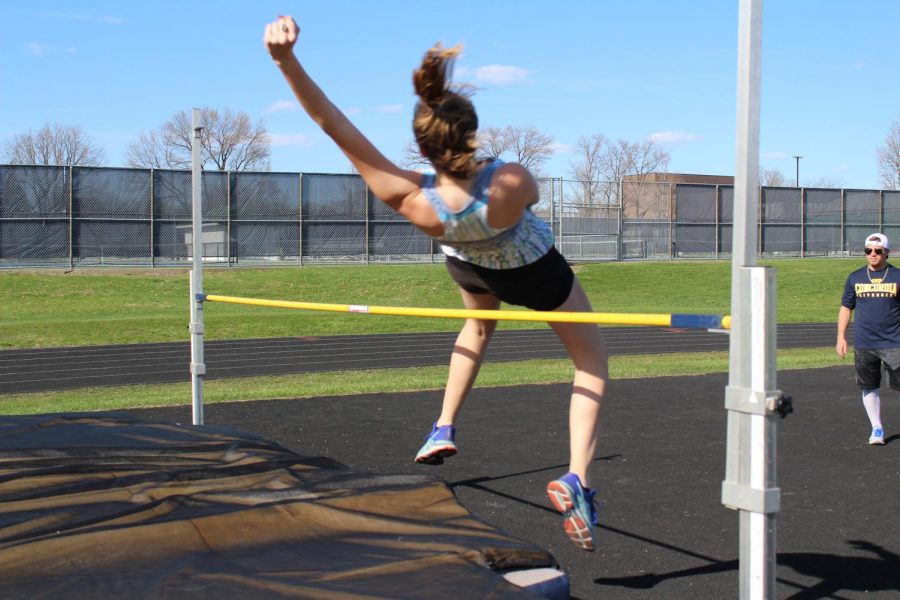 Junior Alessandra Costalonga warms up her high jump. 