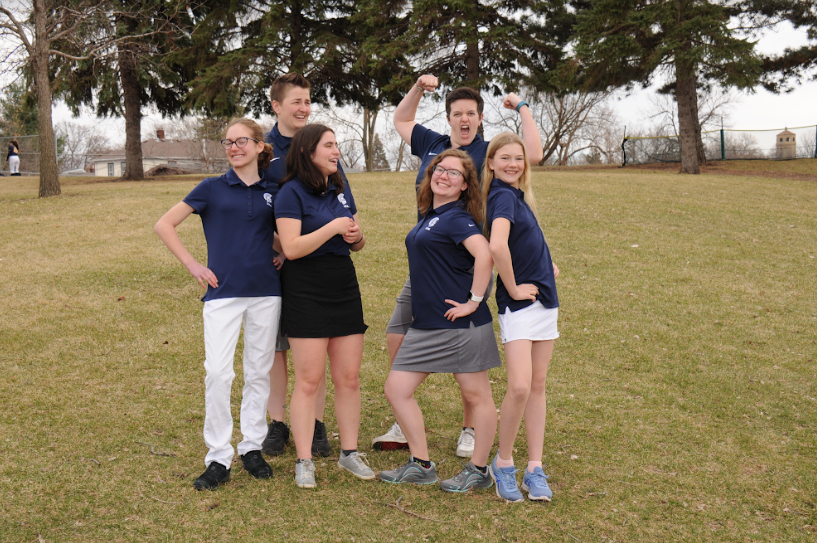 The girls golf team poses for a photo.