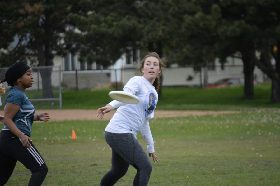 Sophomore Allison Audette throws the Frisbee. 