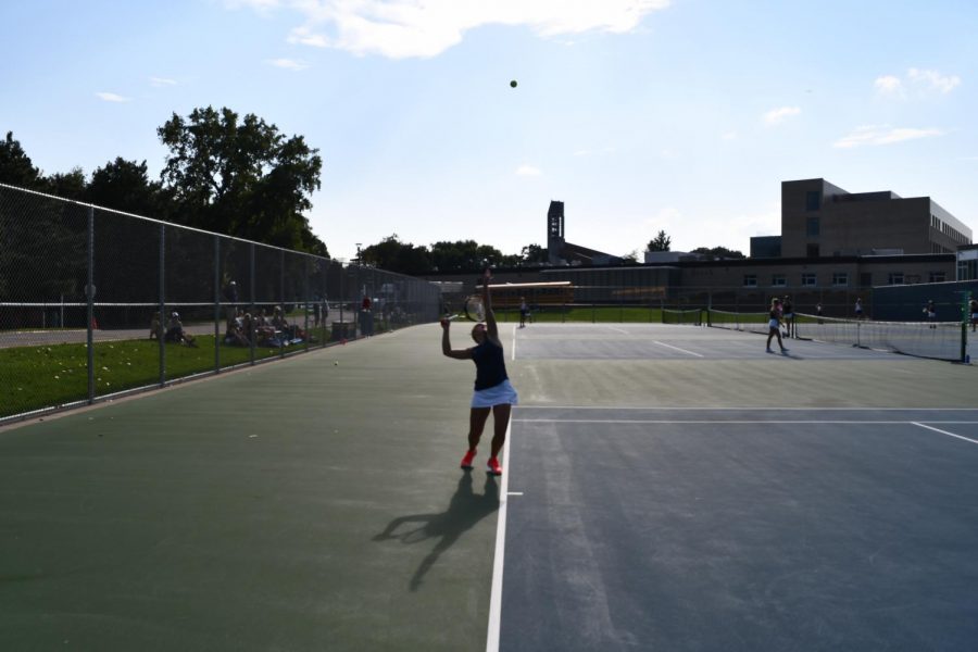 Sophomore Elizabeth Trevathan is up to serve in her singles match.