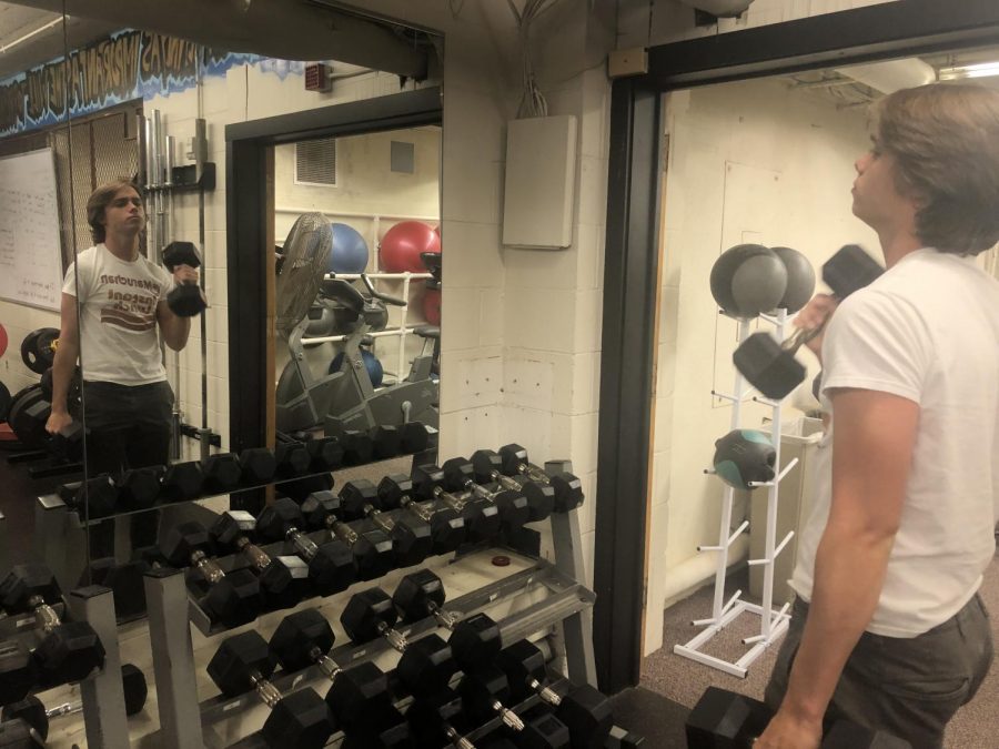 Junior Theo Moen prepares in the offseason for lacrosse by lifting weights. Lifting helps give you a chance to strengthen areas of your game that you might not be able to get from the practice field, he said.