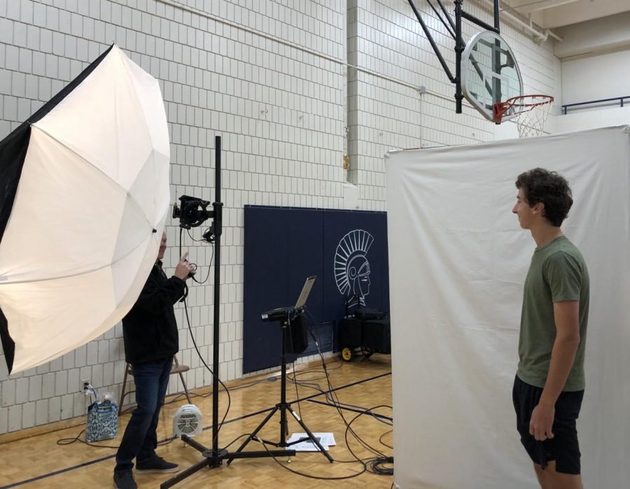 Junior Noah Lineman poses for his picture retake. They [the photographers] are always telling you to move you head in weird ways, he said. 