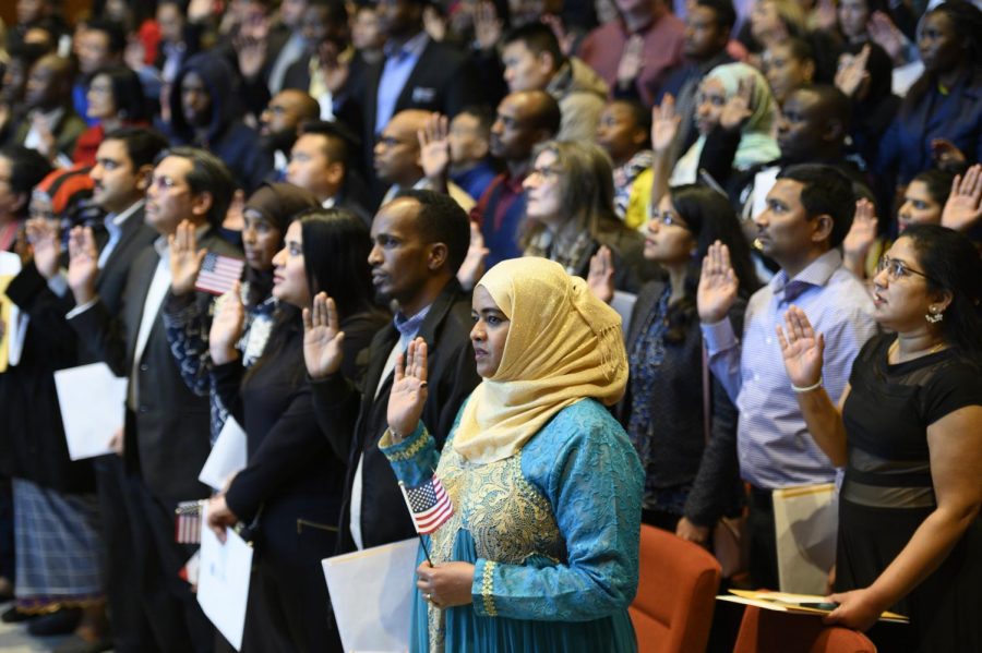 New U.S. citizens recite after the judge during the swearing in ceremony.