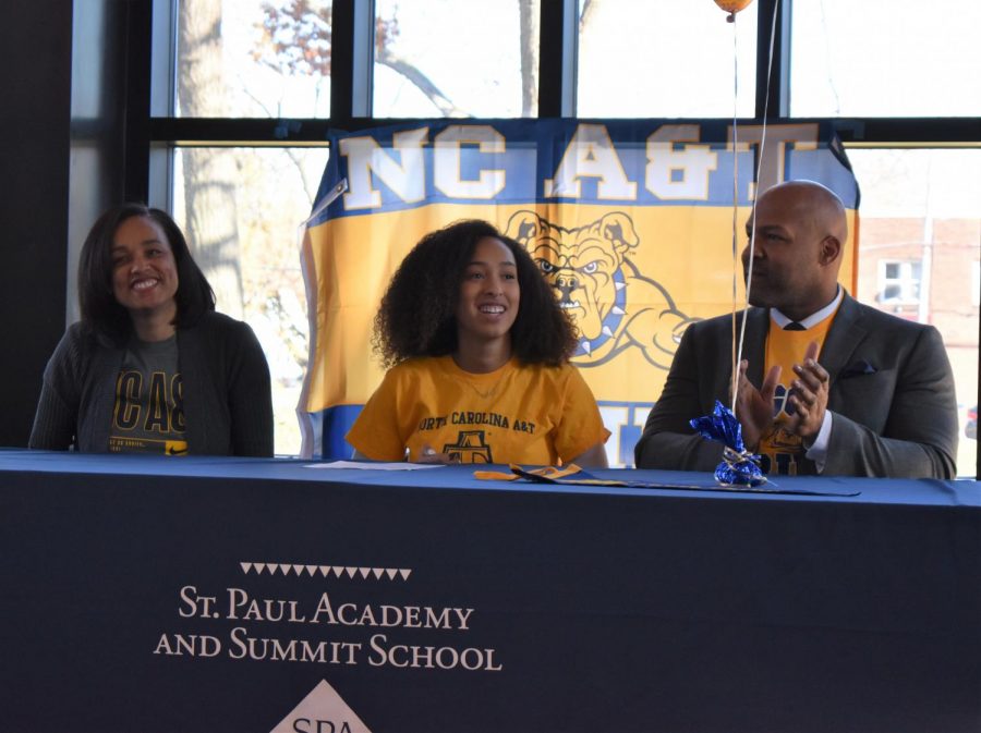 Senior Arie Walker signed to solidify her commitment to play volleyball for North Carolina A&T State University on Thursday. "I was a little nervous, not gonna lie but being next to my parents helped me a lot. I wasn't too worried about the number of people because I knew they were all there to support me," Walker said. 