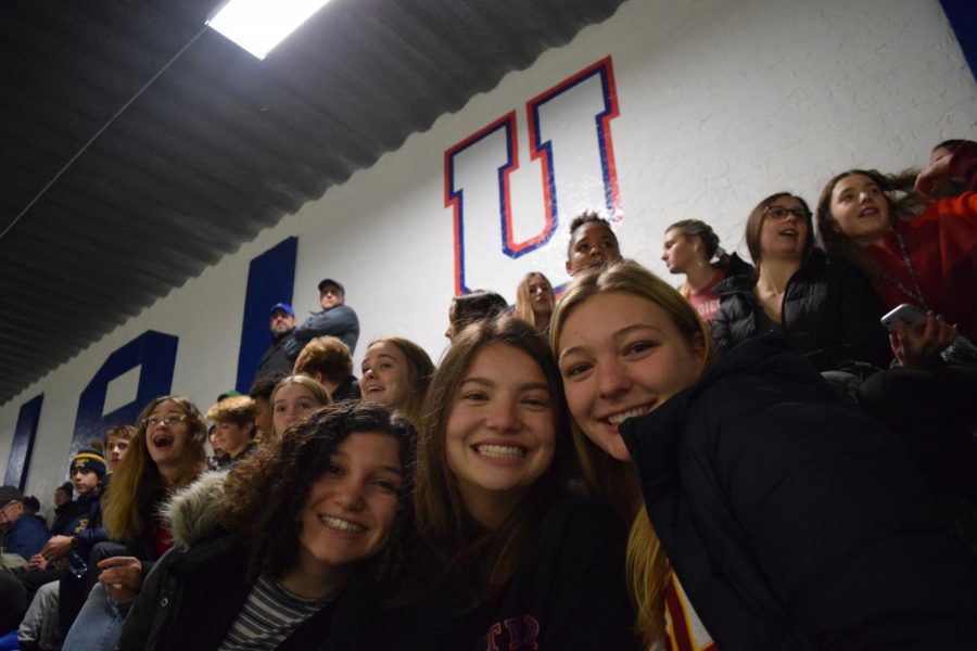 While a large number of fans can be a rare occurrence at sporting events, lots of students turned out to the Dec. 5 hockey game vs. rival Mahtomedi, demonstrating the atmospheric change that student support can bring. Here, Seniors Libby Cohen, Issy Weber and Helen Bartlett are all smiles at the game. 