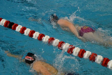 Swimmers warm-up before the meet.