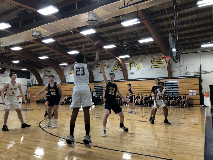 Senior Griffin Thissen defends a shot from Eagle Ridge during the game.