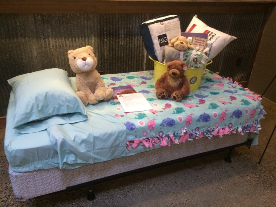 An example bed that My Very Own Bed would provide, including a mattress, blankets, a pillow, and a stuffed animal among other things to the children.